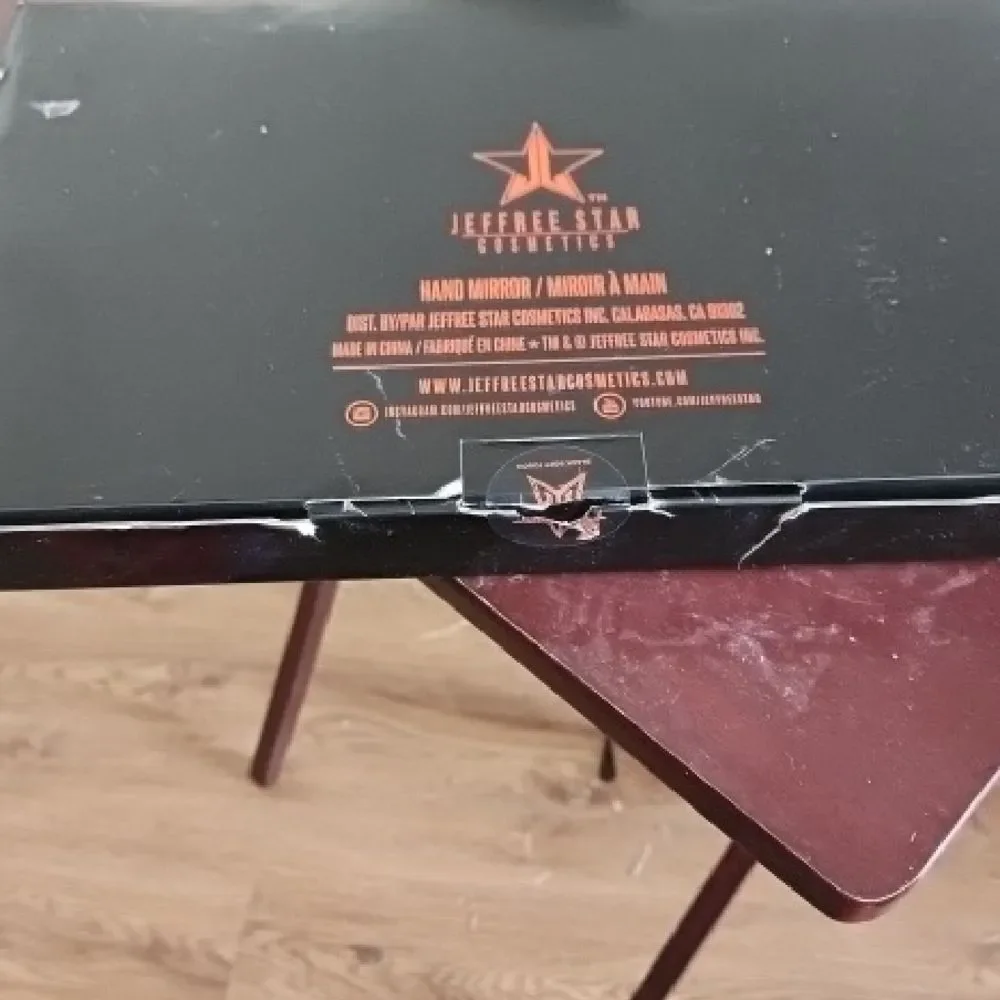 Jeffree Star Black Mirror with Orange Star Design